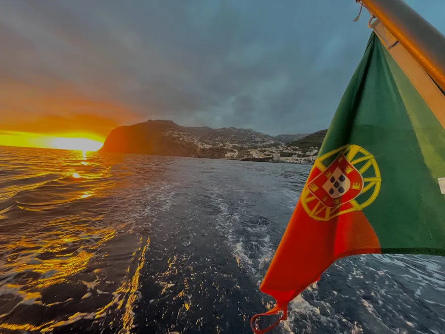 The Portuguese flag on Spica with the sunset behind