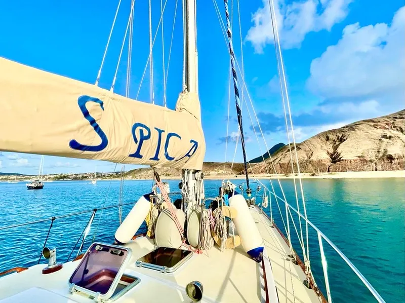 The bow of Spica at anchor off the beach of Porto Santo
